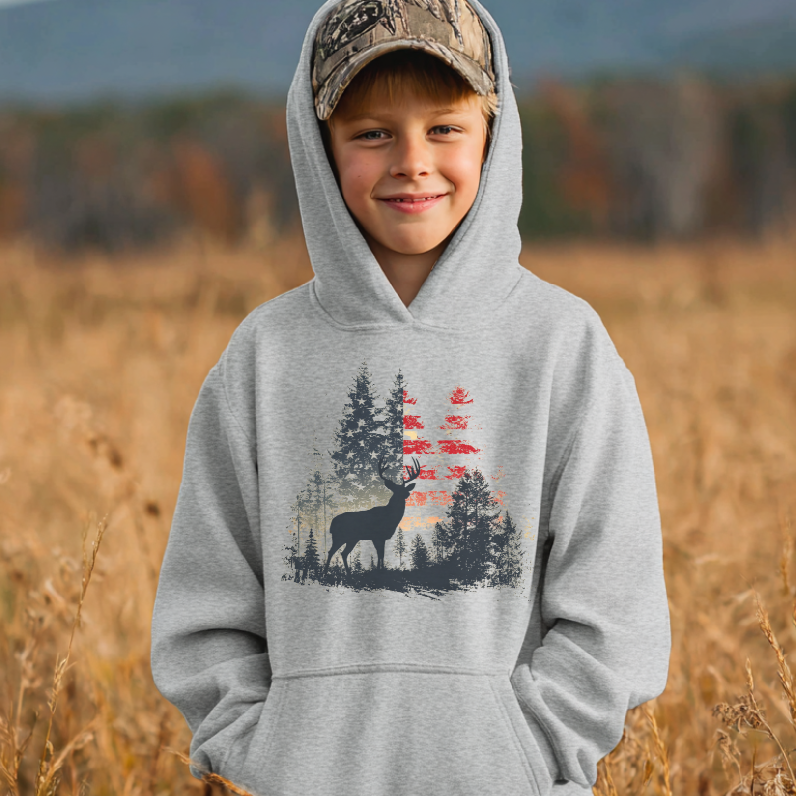 Child wearing a hoodie with a deer design in a natural setting
