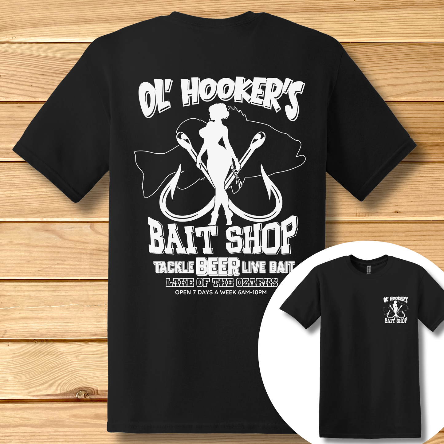 Black t-shirt with white graphic design on a wooden surface