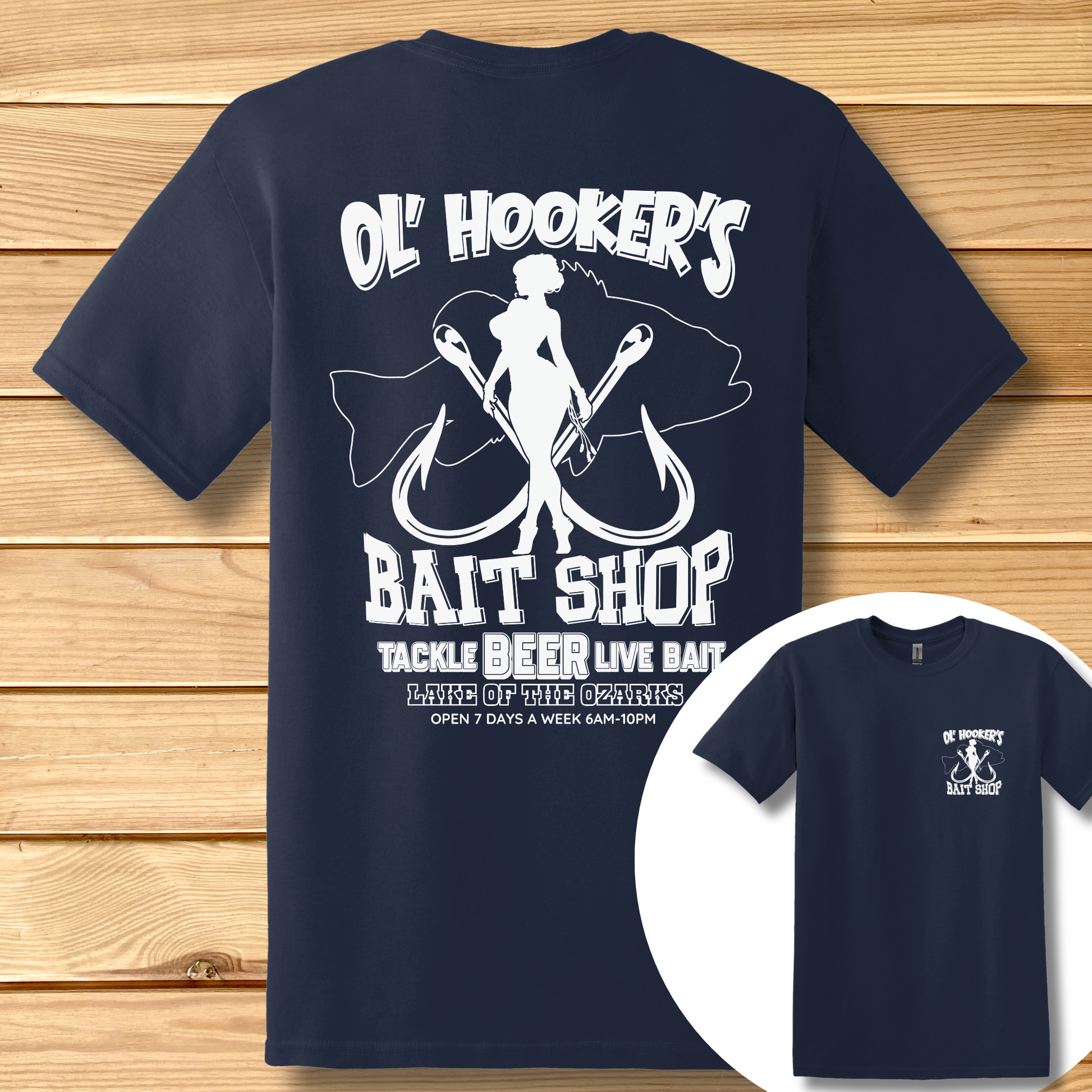 Navy blue t-shirt with white graphic and text on a wooden surface