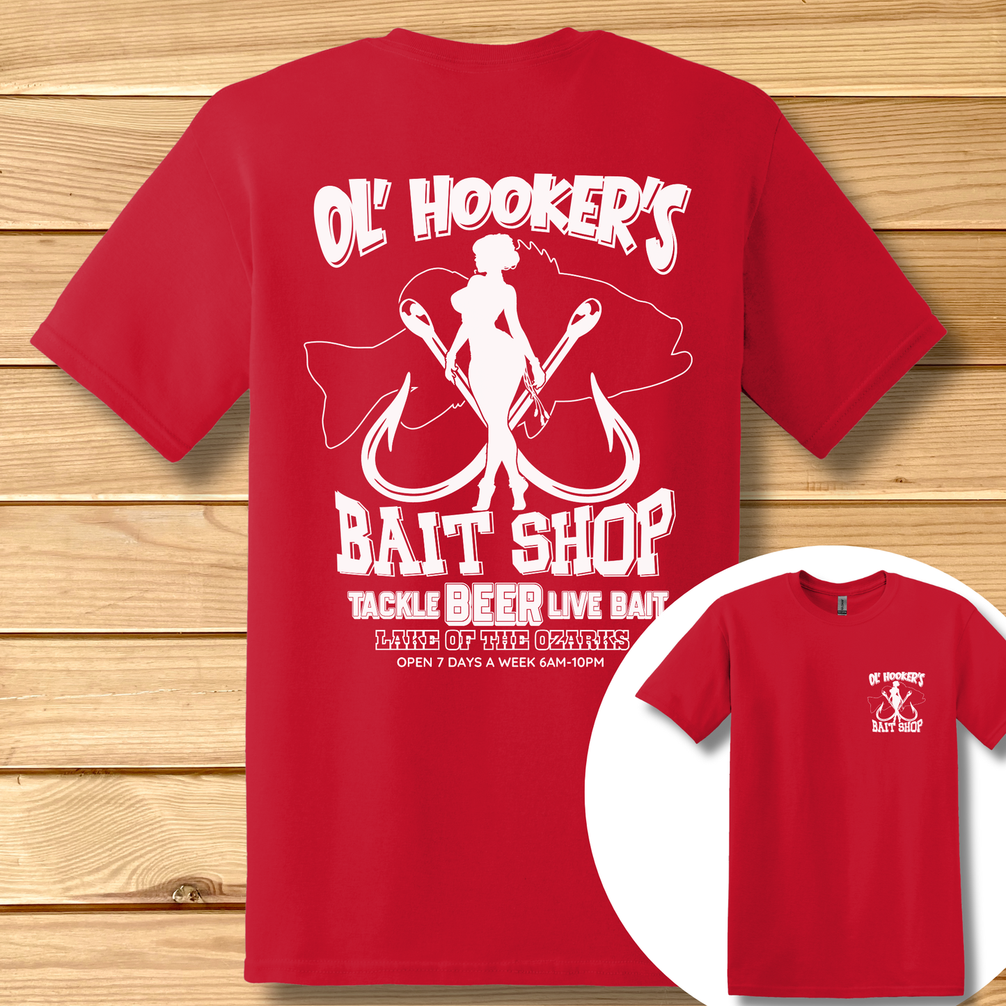 Red t-shirt with white graphic and text on a wooden surface