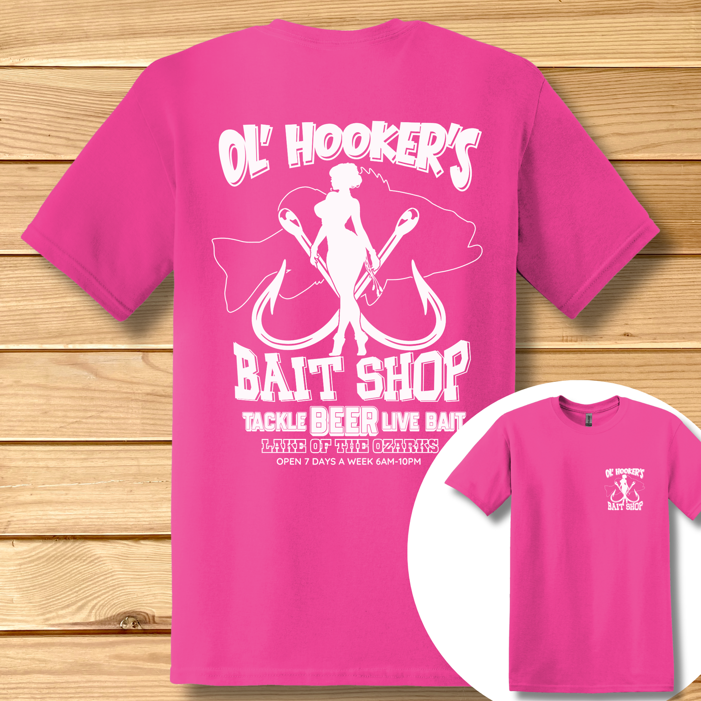 Pink t-shirt with white graphic and text on a wooden surface