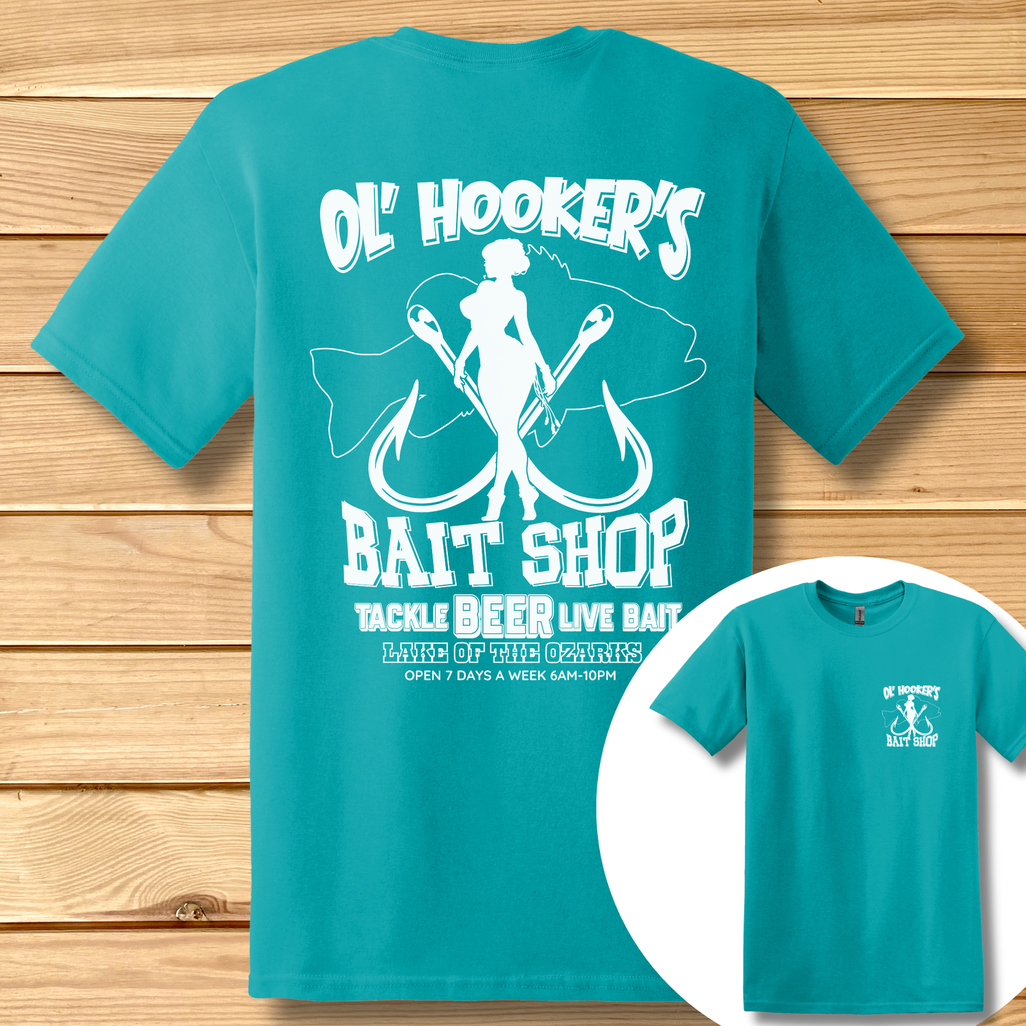 Teal t-shirt with white graphic and text on a wooden surface