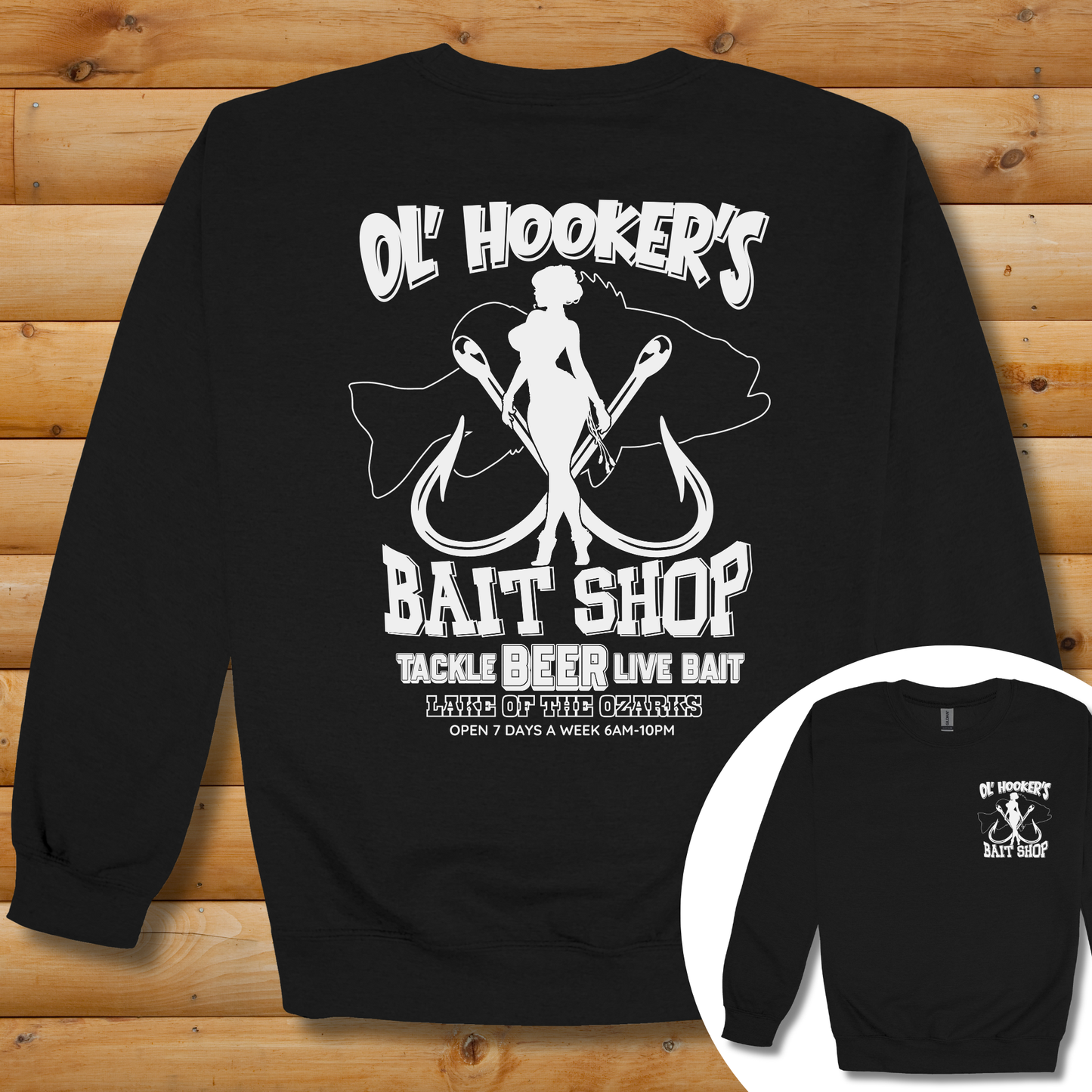 Black sweatshirt with white graphic design on a wooden surface
