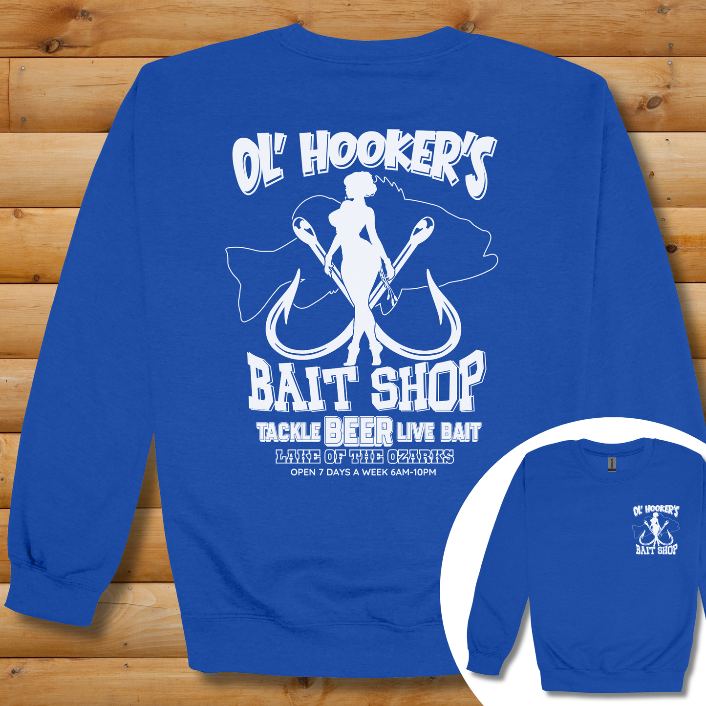 Blue sweatshirt with white graphic design on a wooden background
