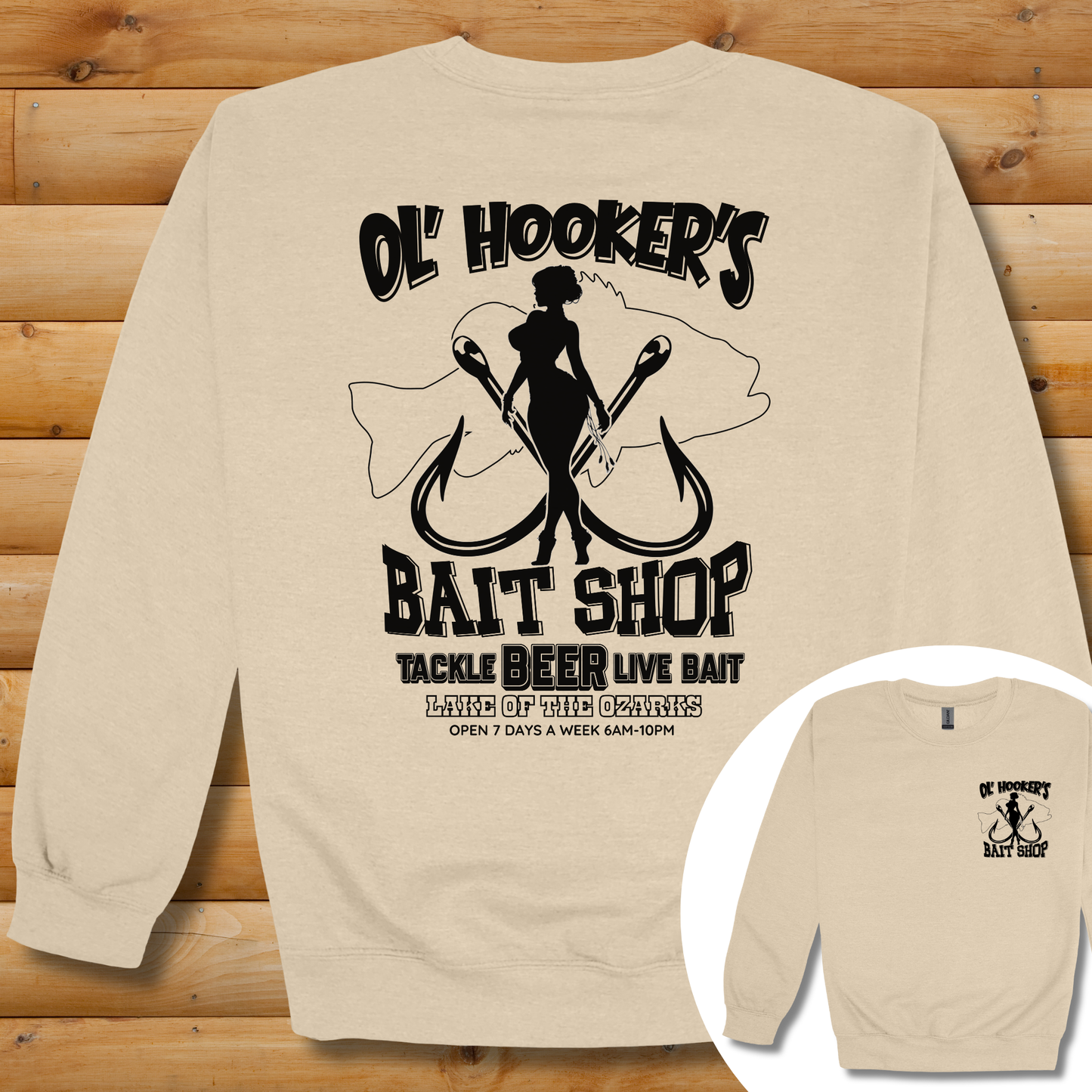 Beige sweatshirt with black graphic design on a wooden background