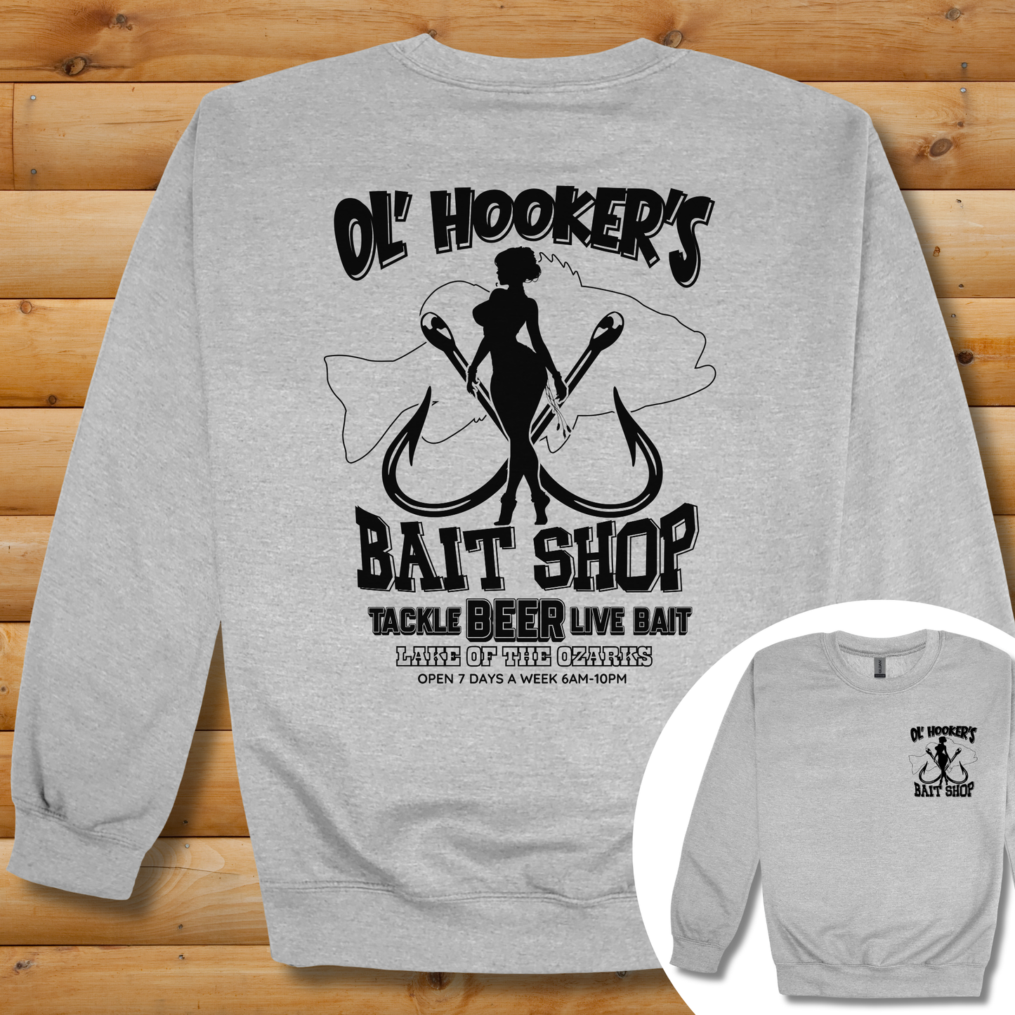 Gray sweatshirt with black graphic design on a wooden surface