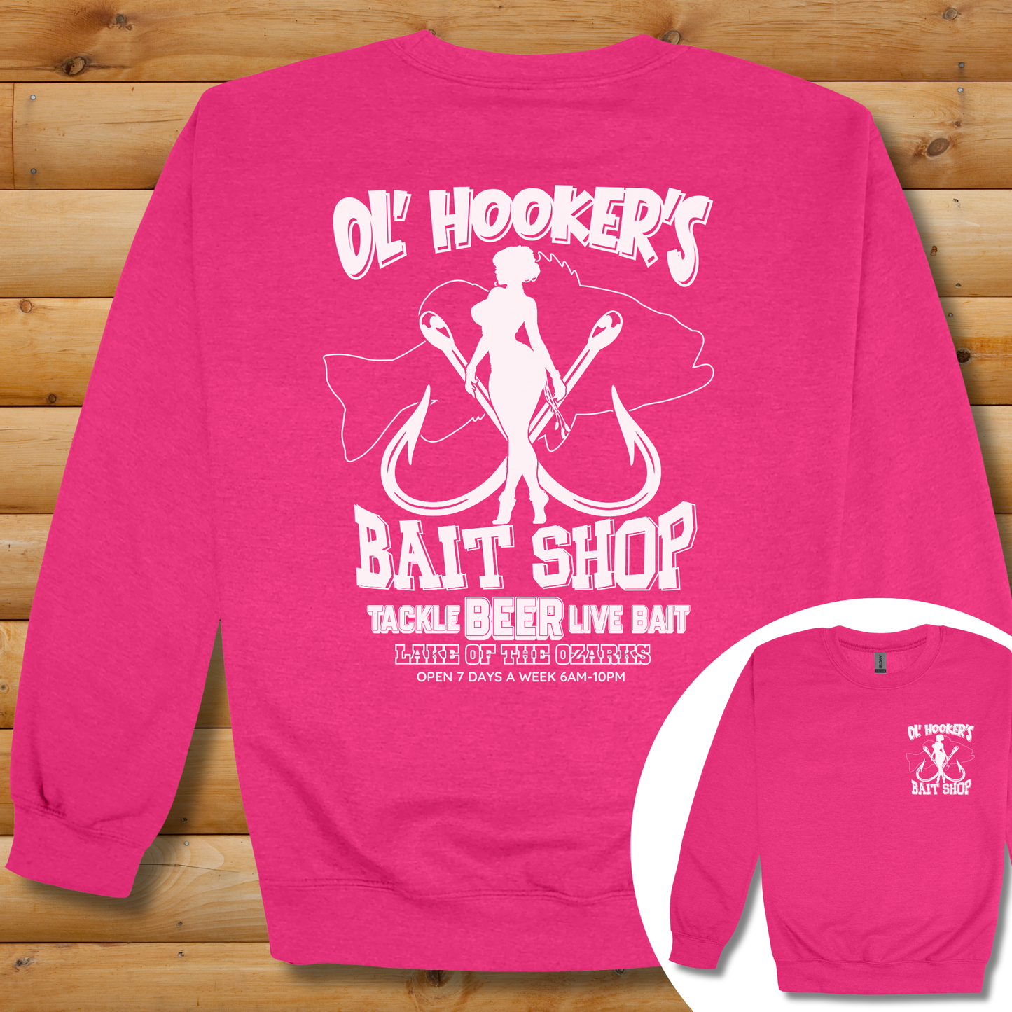 Pink sweatshirt with 'Ol' Hooker's Bait Shop' graphic on a wooden background
