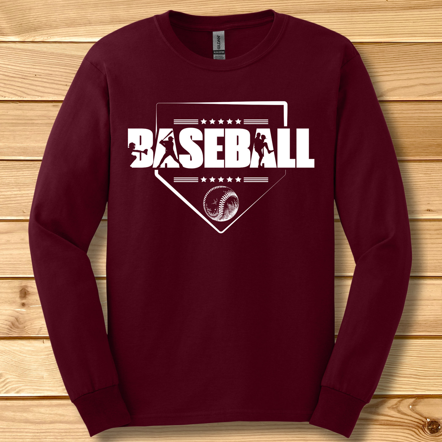 Maroon long-sleeve shirt with 'BASEBALL' design on a wooden background