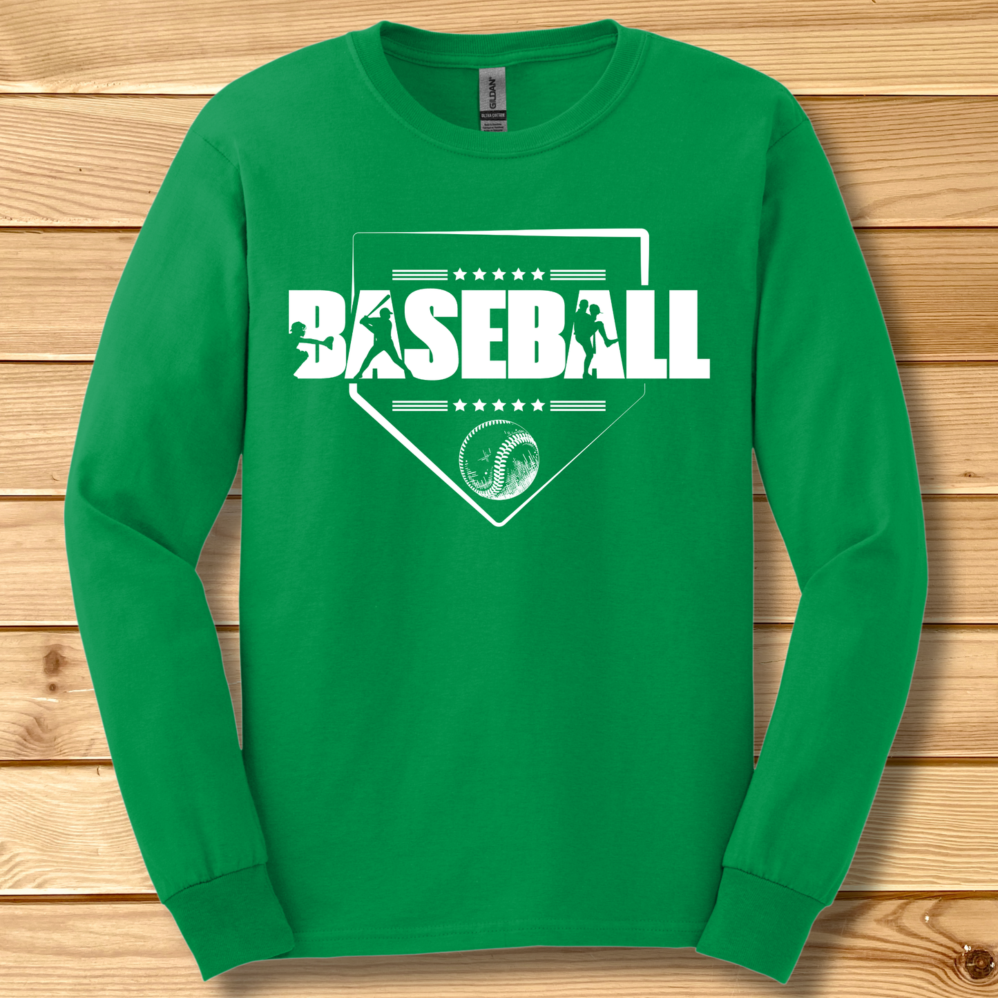 Green long-sleeve shirt with 'BASEBALL' design on a wooden background