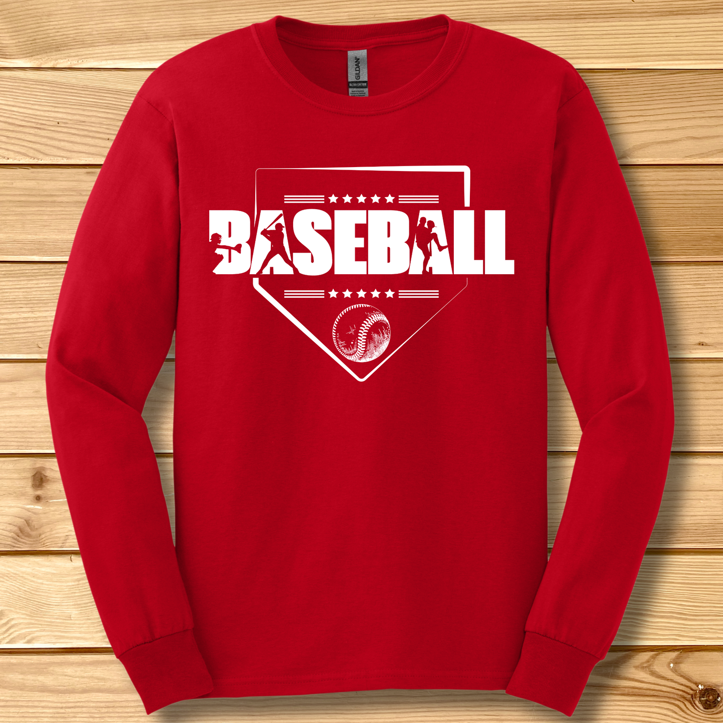 Red long-sleeve shirt with 'BASEBALL' design on a wooden background