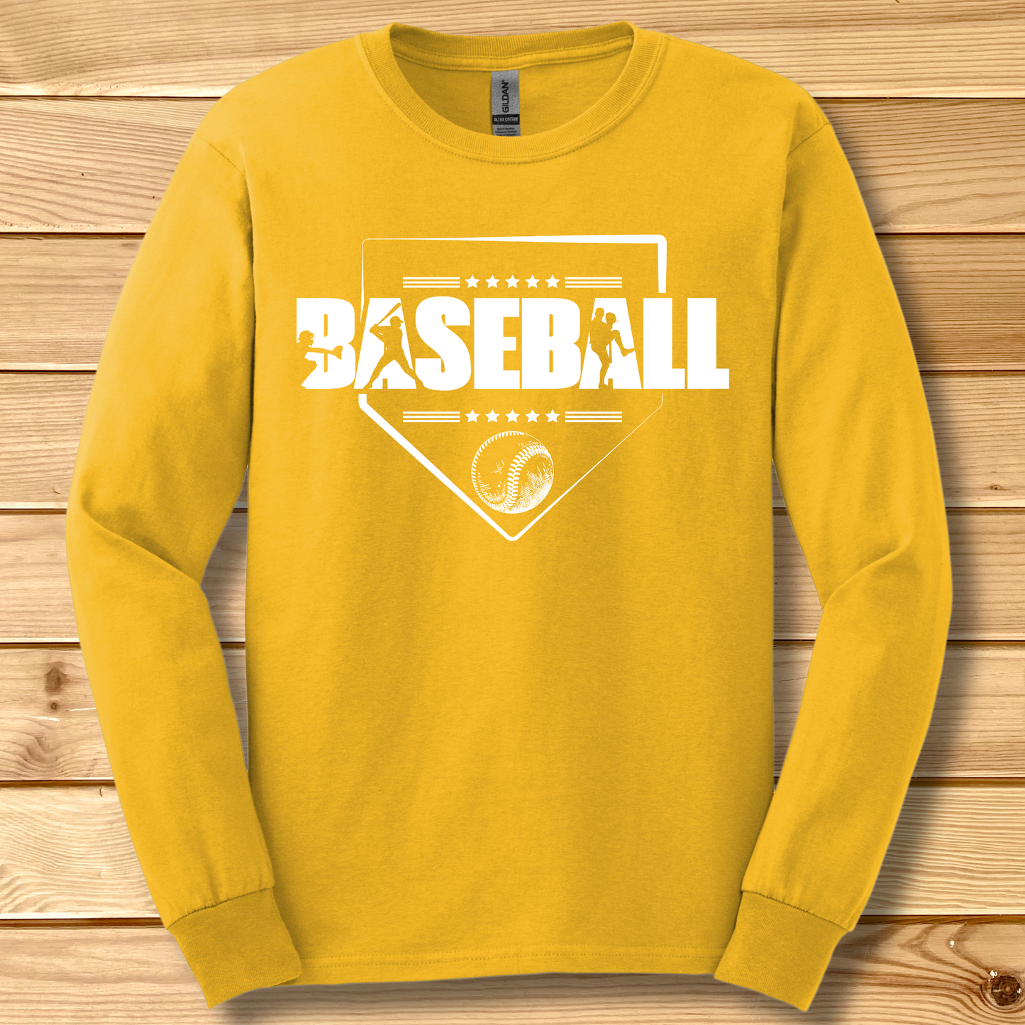 Yellow long-sleeve shirt with 'BASEBALL' design on a wooden background