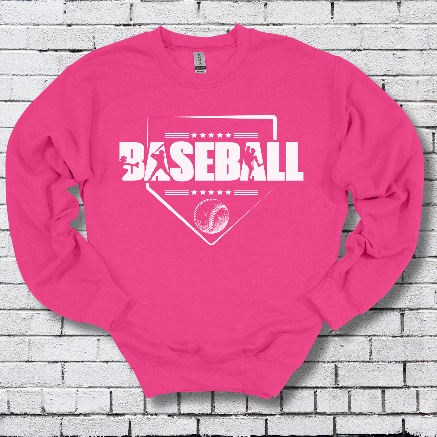 Pink sweatshirt with 'BASEBALL' design on a brick wall background