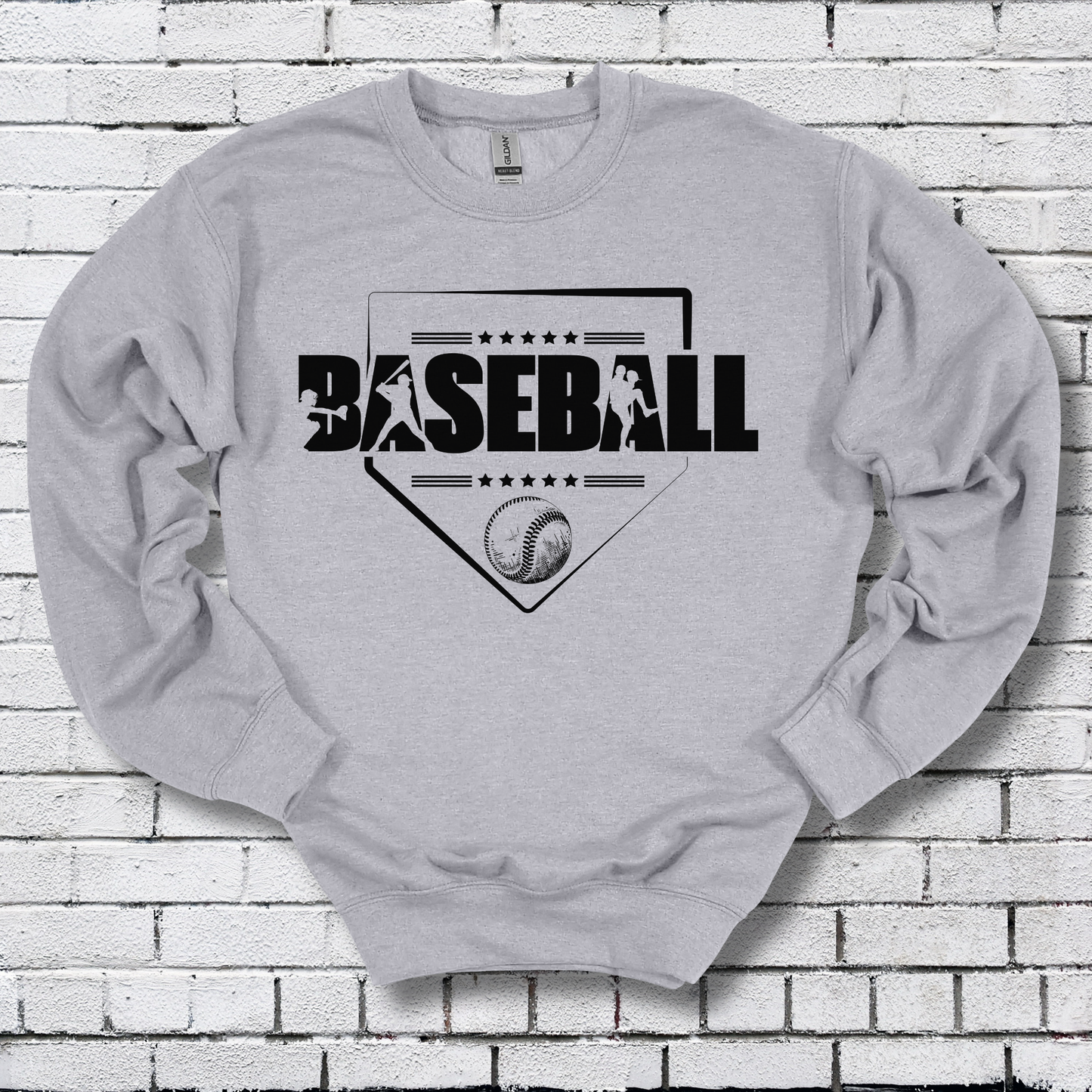 Gray sweatshirt with 'BASEBALL' design on a brick wall background