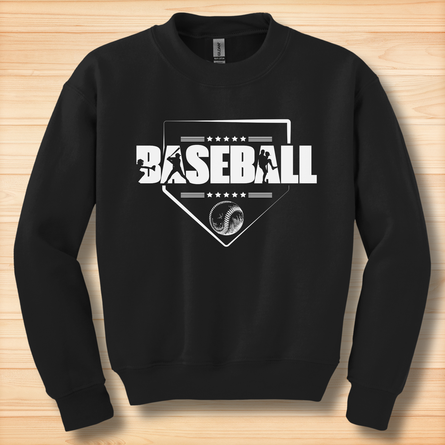 Black sweatshirt with white baseball graphic on a wooden surface