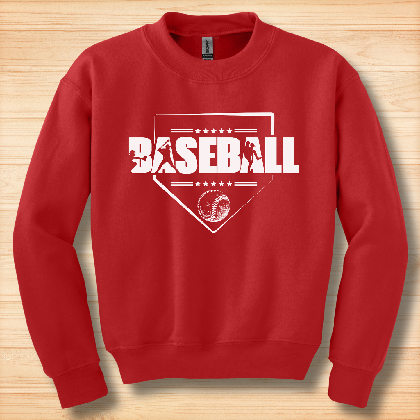 Red sweatshirt with 'BASEBALL' design on a wooden surface