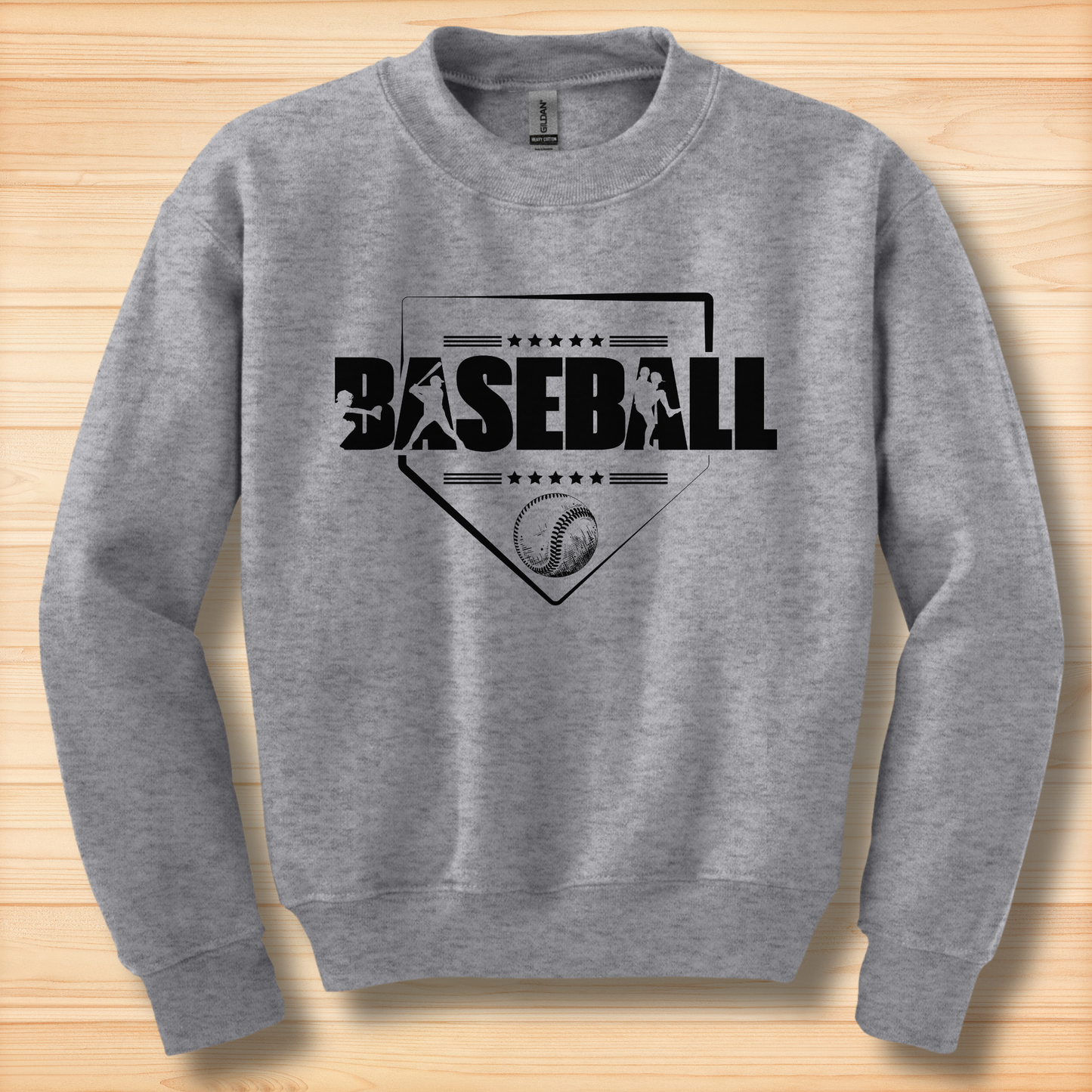 Gray sweatshirt with 'BASEBALL' design on a wooden surface