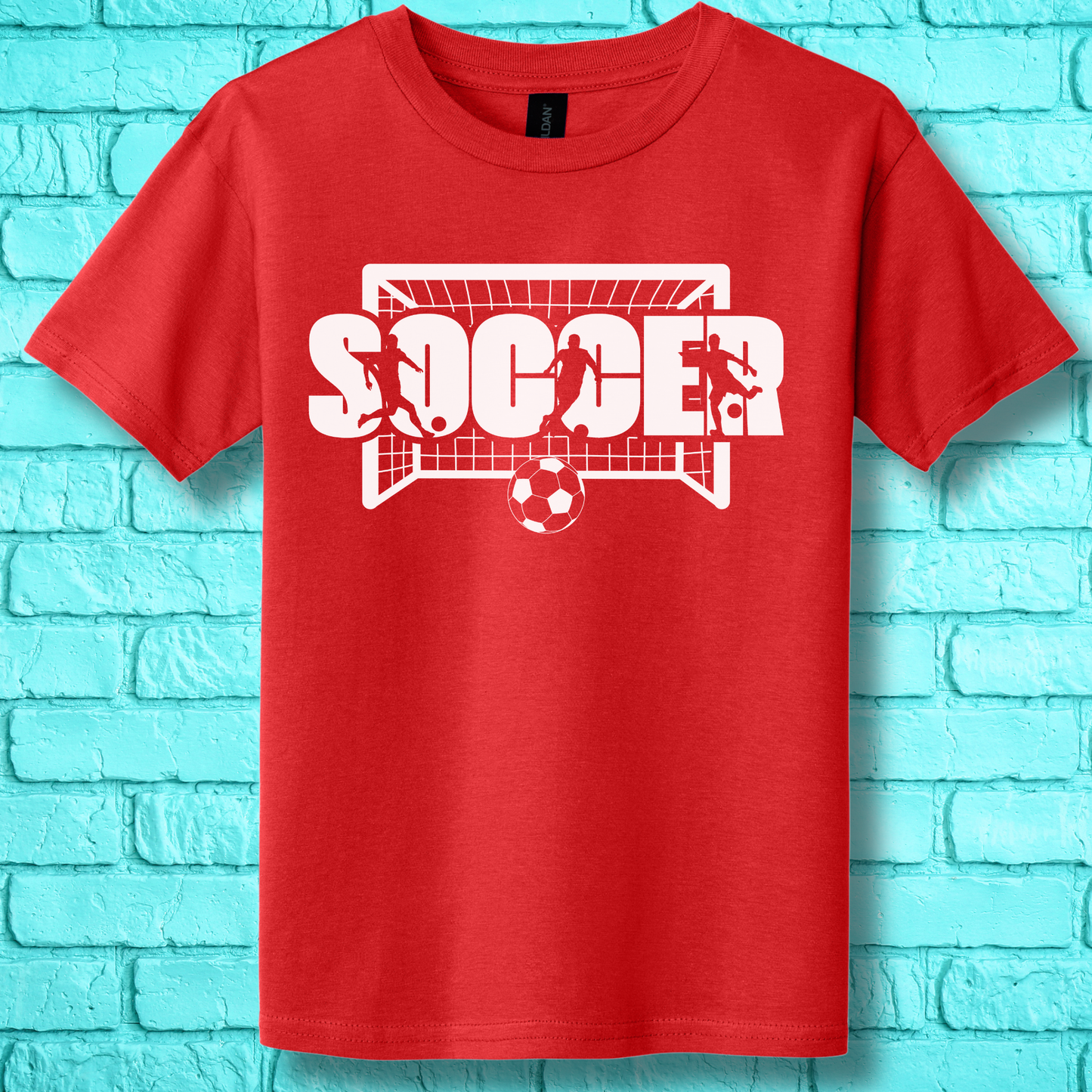 Red t-shirt with 'SOCCER' graphic on a blue brick wall background