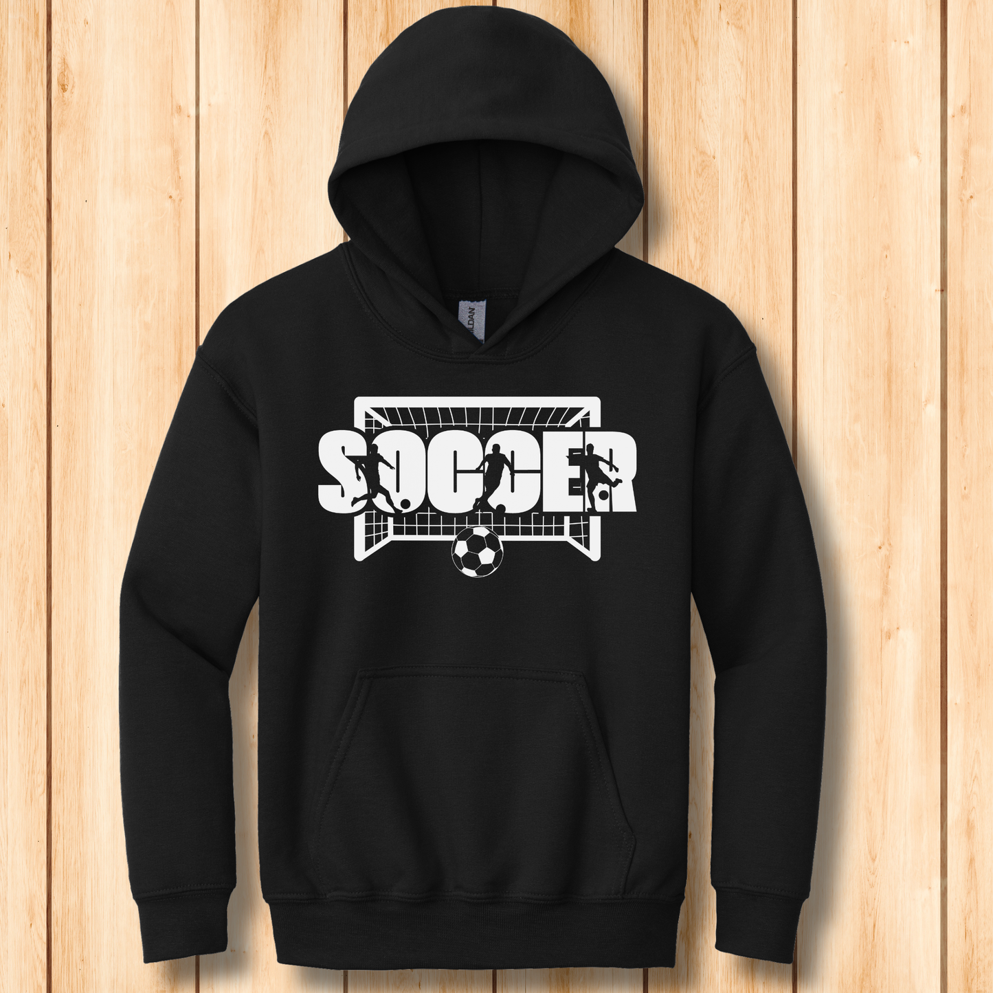 Black hoodie with soccer graphic on a wooden background