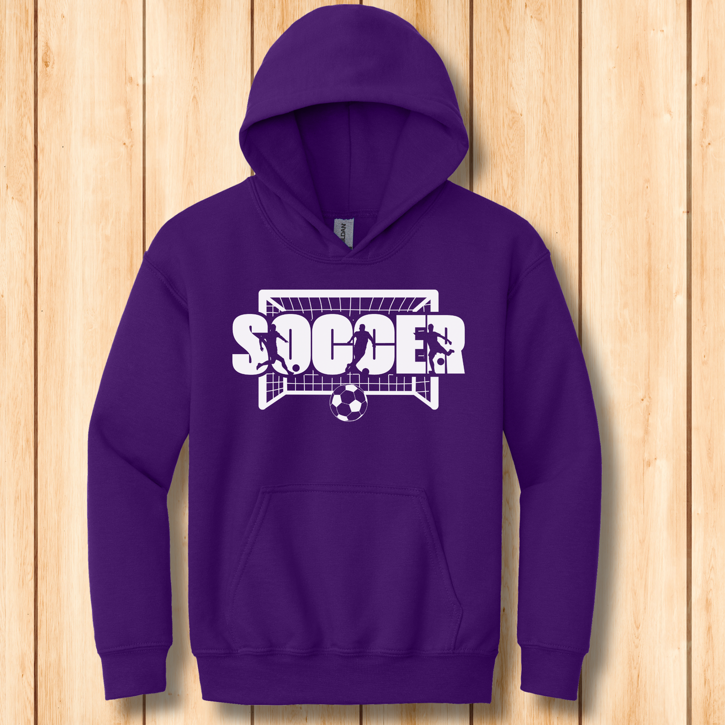 Purple hoodie with soccer design on a wooden background