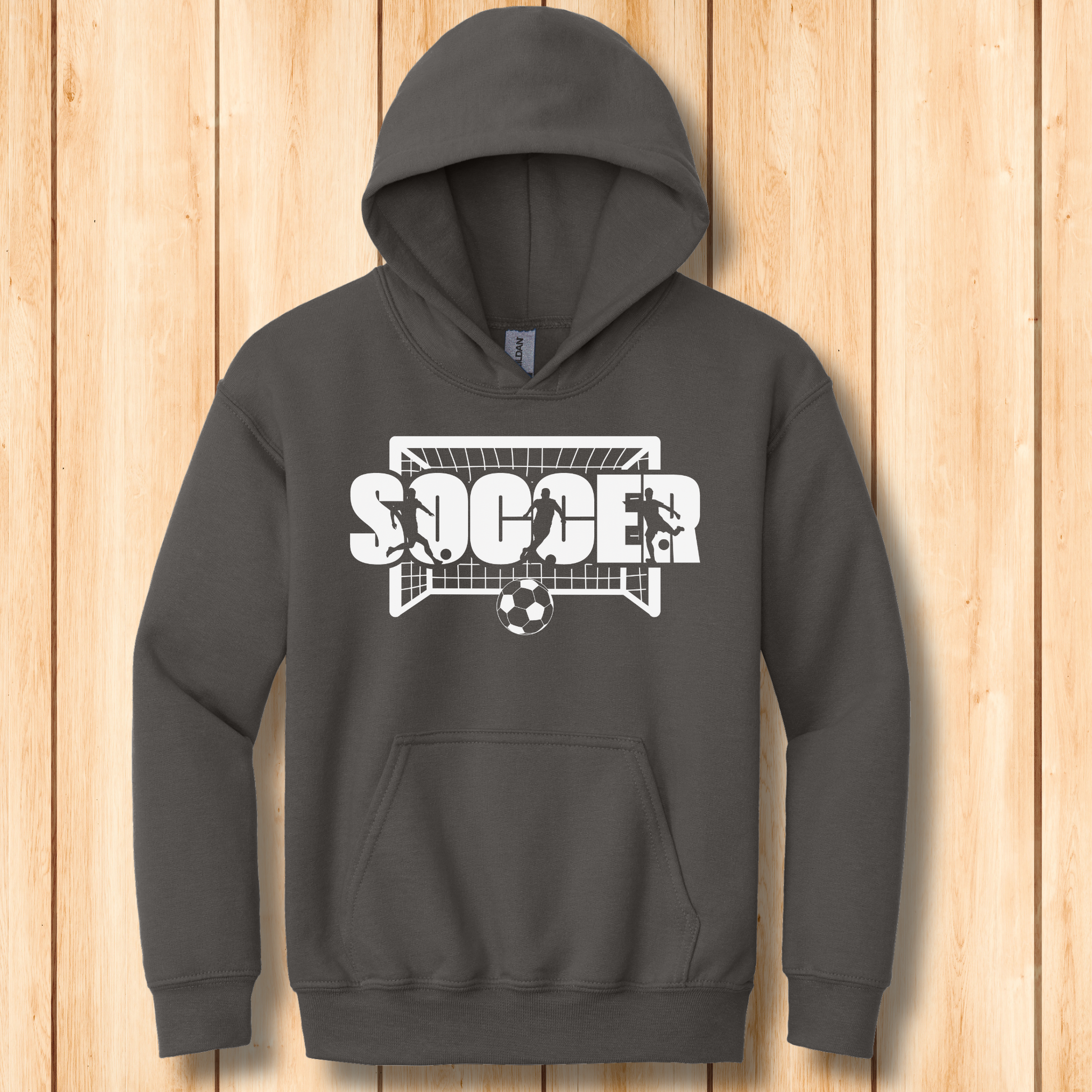 Dark gray hoodie with soccer graphic on a wooden surface