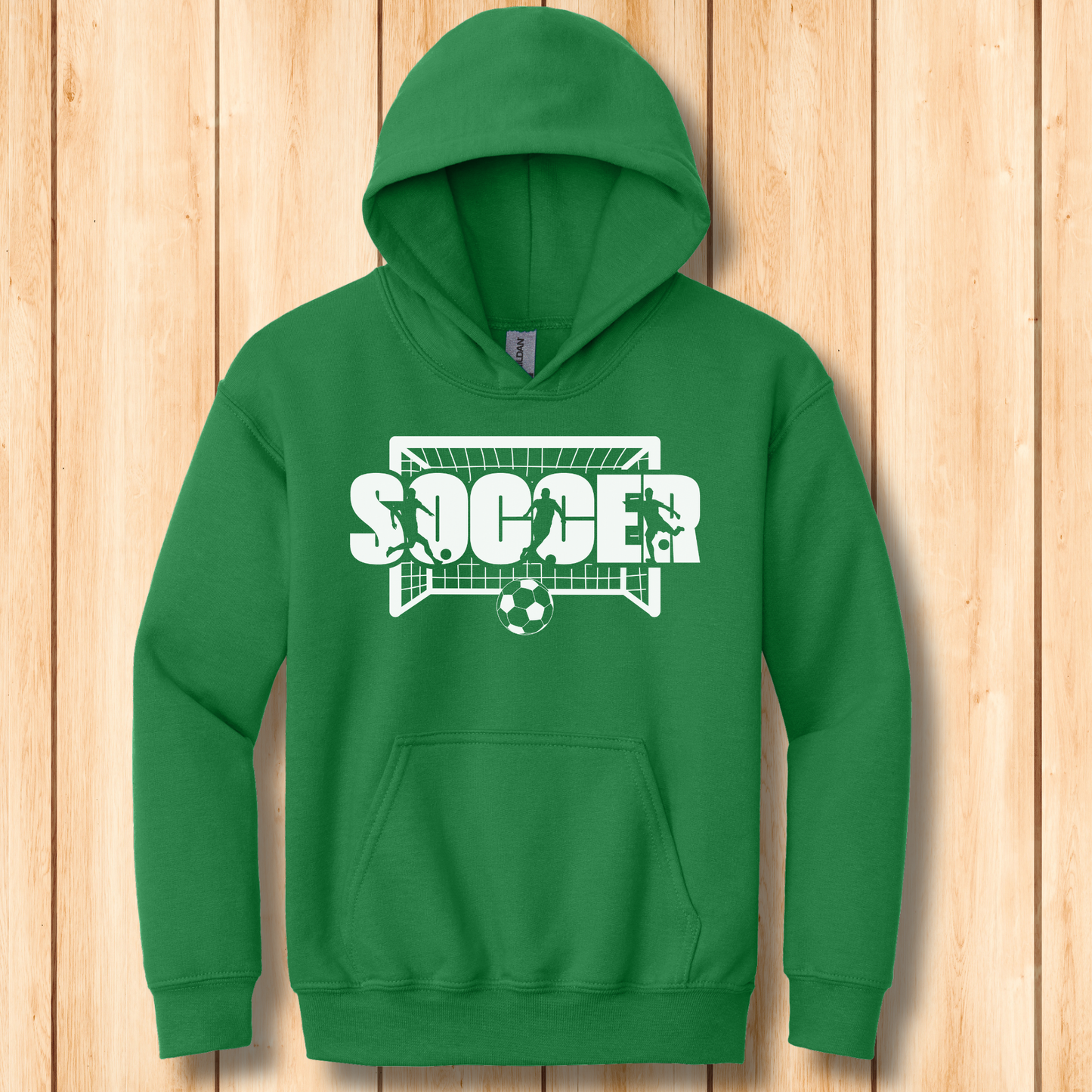Green hoodie with 'Soccer' graphic on a wooden background
