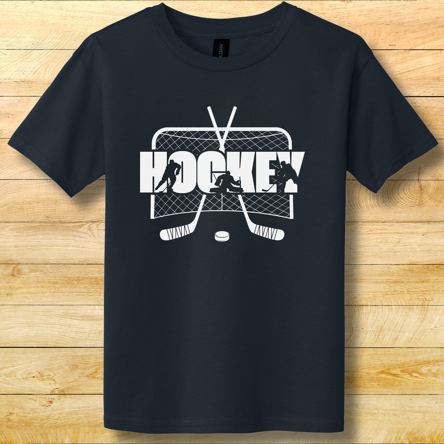 Black t-shirt with white hockey graphic on a wooden surface