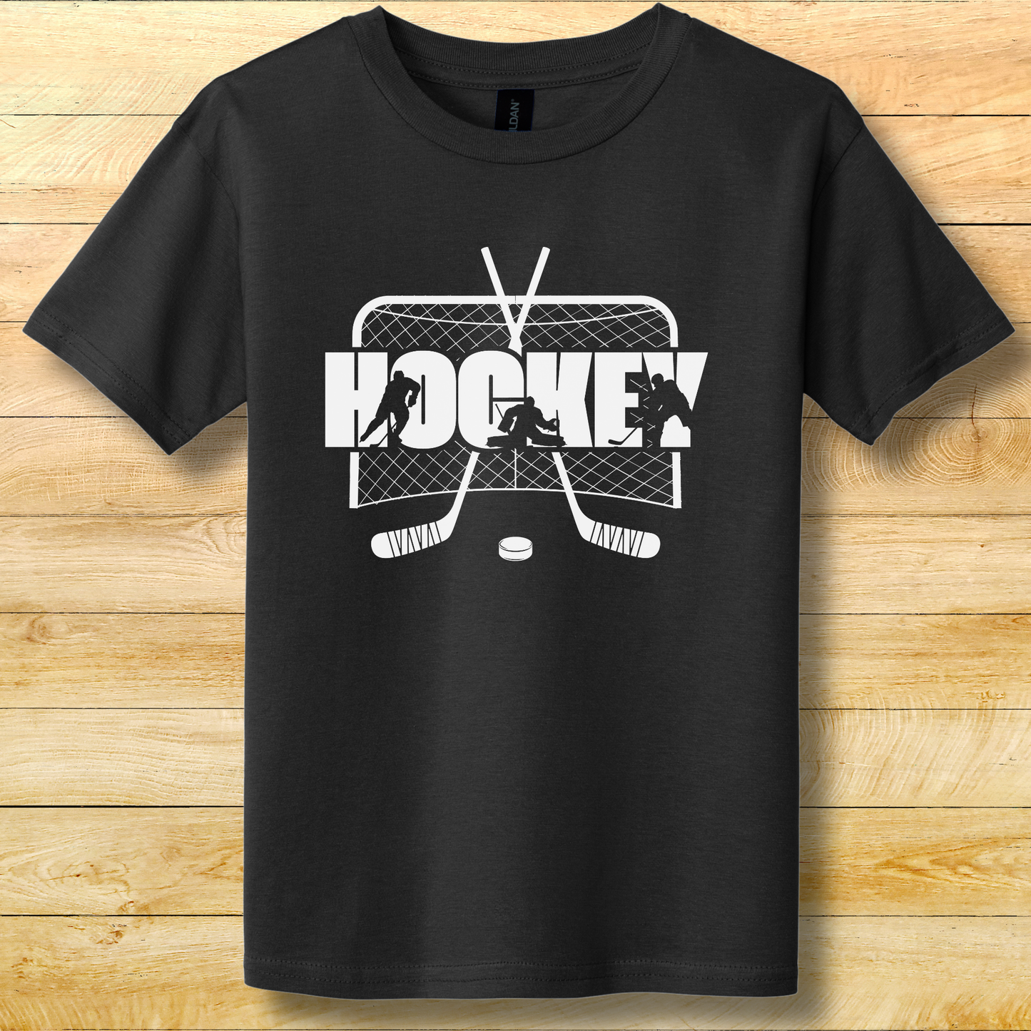 Black t-shirt with white hockey graphic on a wooden surface
