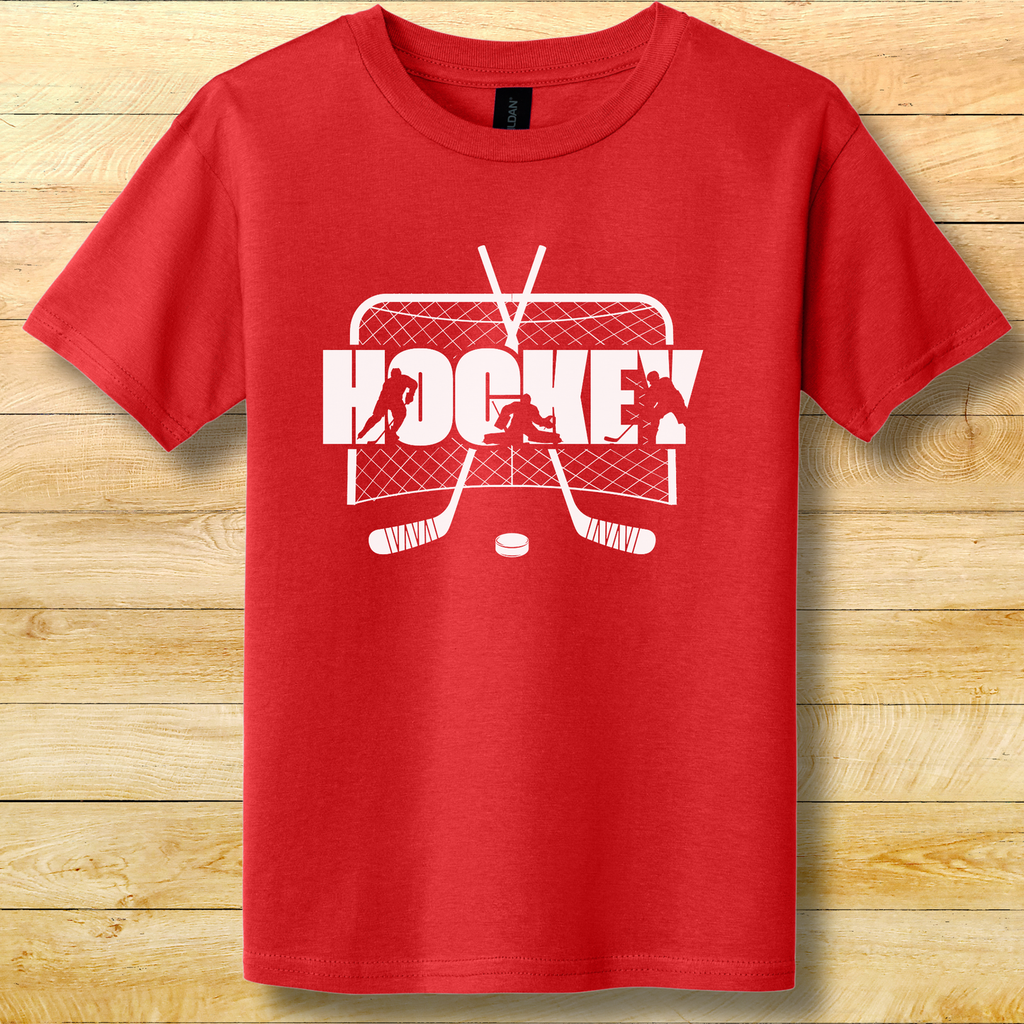 Red t-shirt with white hockey graphic on a wooden background