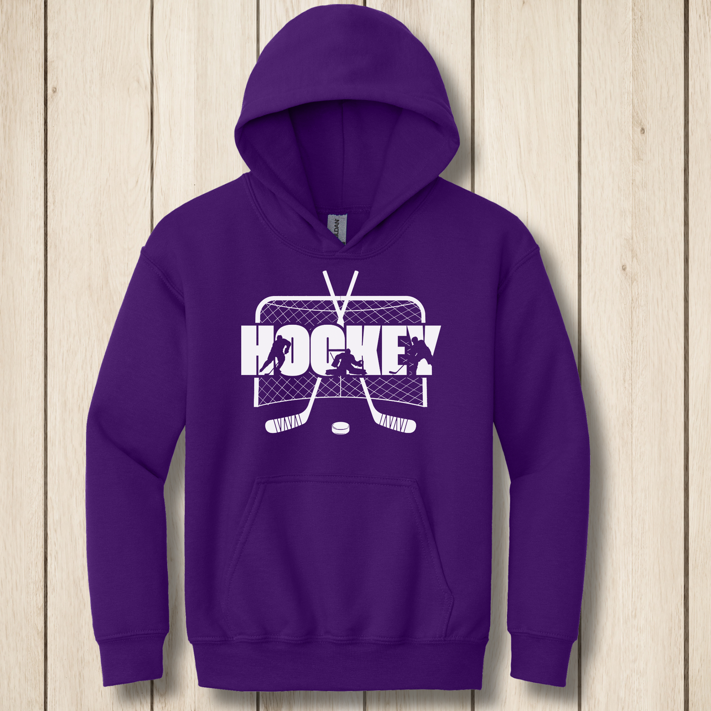 Purple hoodie with hockey graphic on a wooden surface