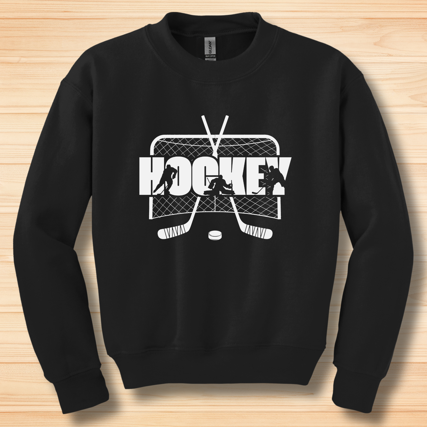 Black sweatshirt with hockey graphic on a wooden surface