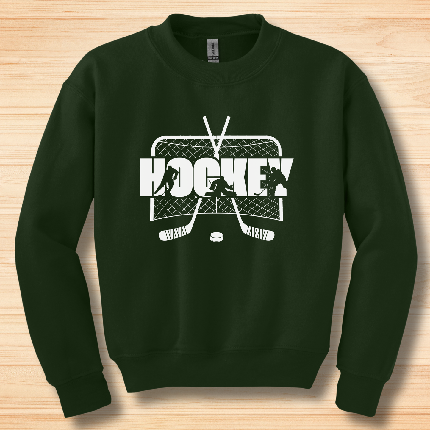 Green sweatshirt with hockey graphic on a wooden surface