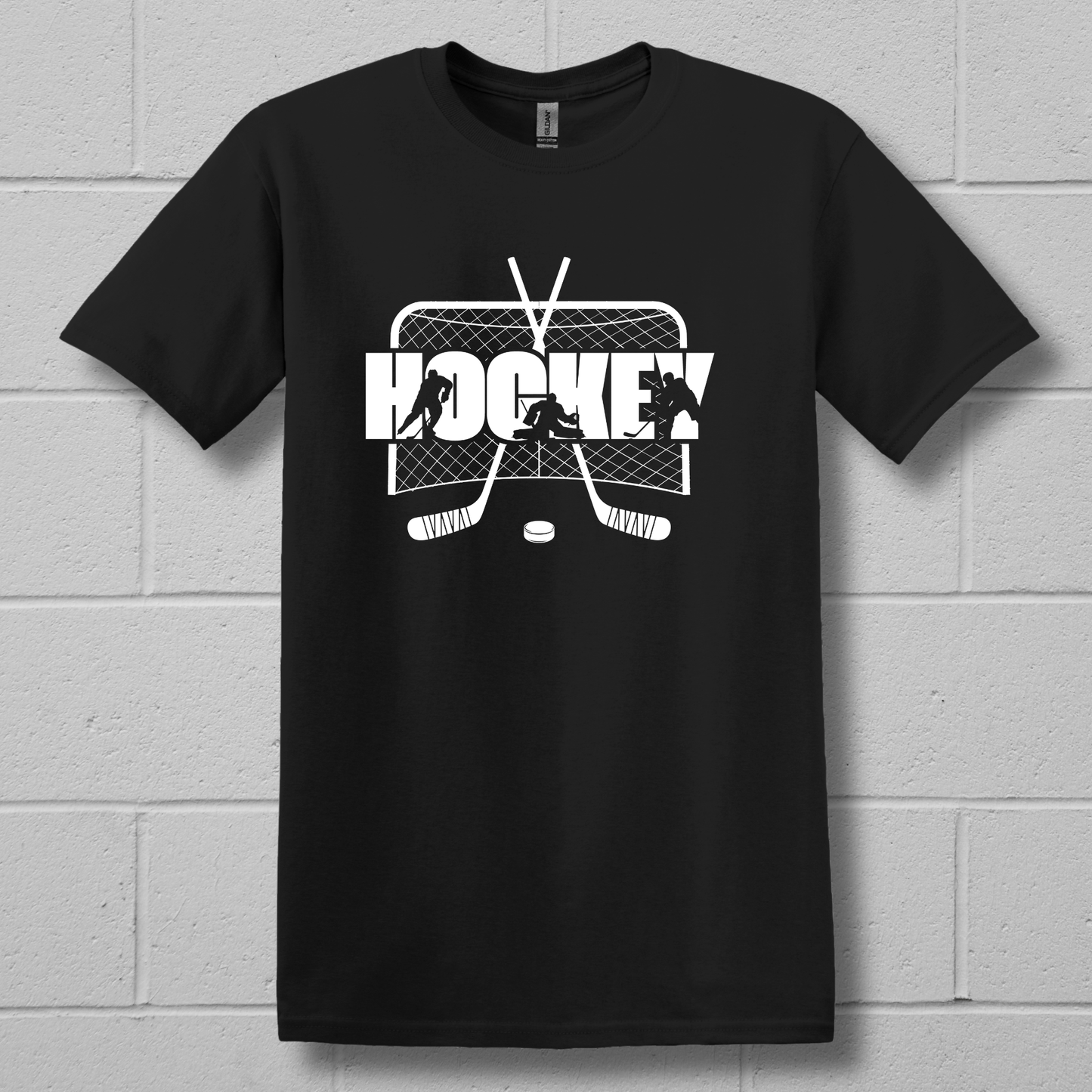Black t-shirt with white hockey graphic design on a brick wall background