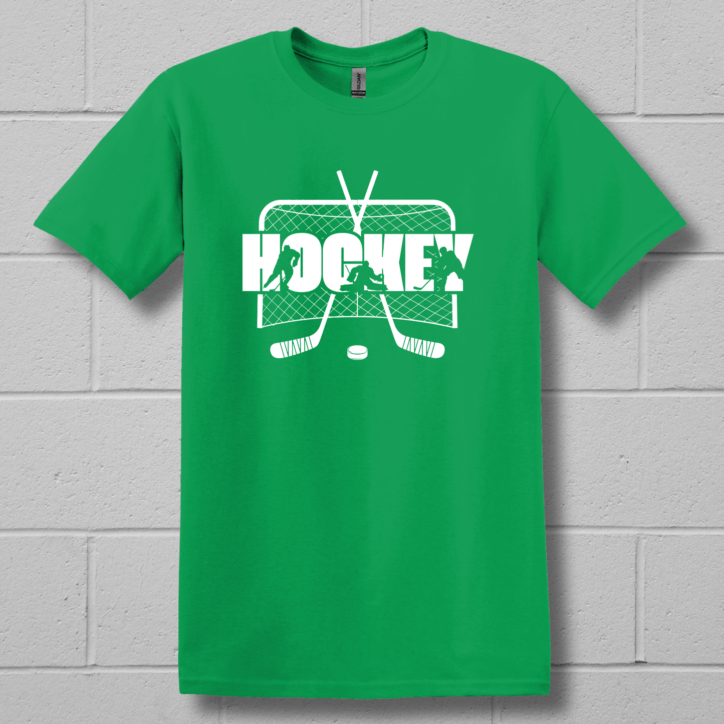 Green t-shirt with white hockey graphic and text on a gray brick wall background