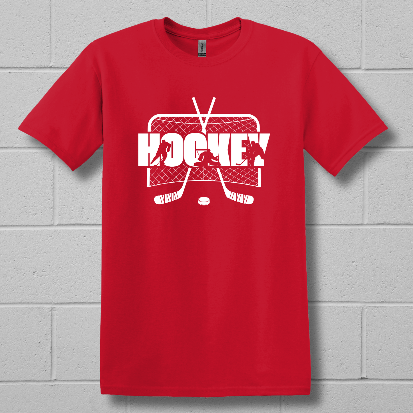 Red t-shirt with white hockey graphic on a gray brick wall background