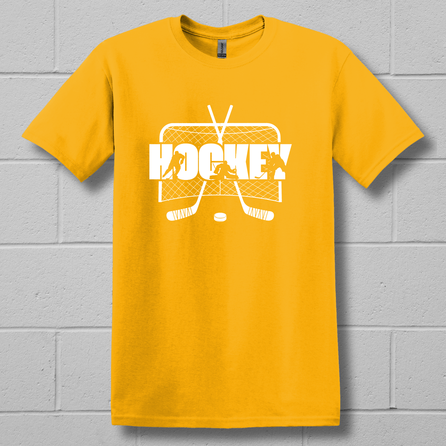 Yellow t-shirt with white hockey graphic and text on a gray brick wall background