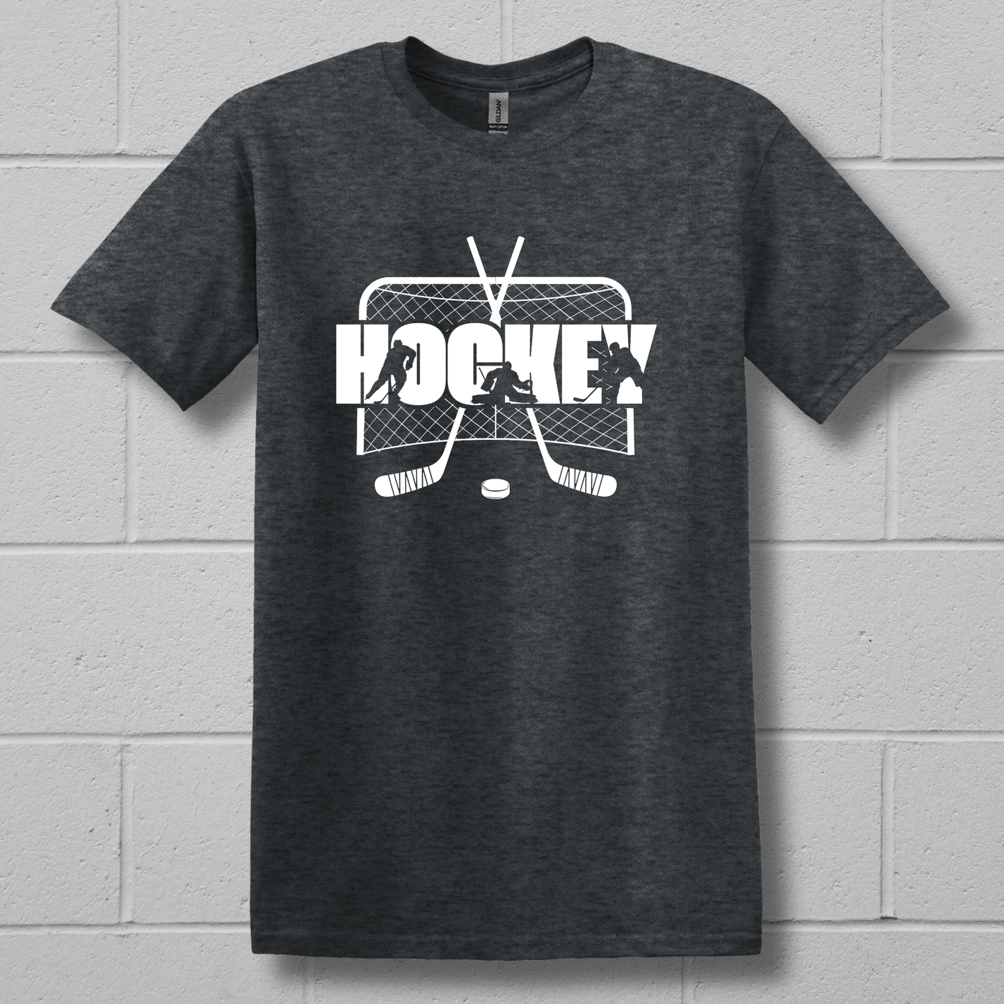 Dark gray t-shirt with white hockey graphic on a brick wall background