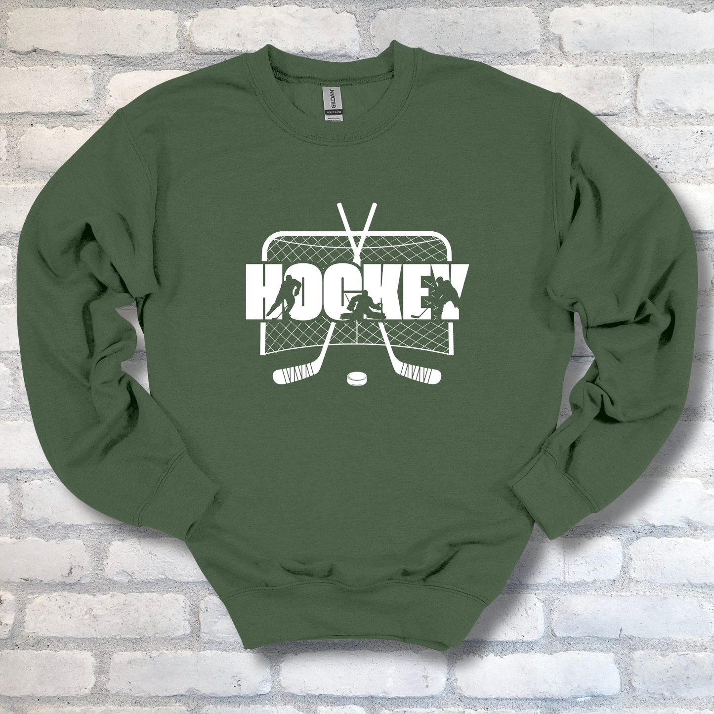 Green sweatshirt with hockey graphic and text on a brick wall background