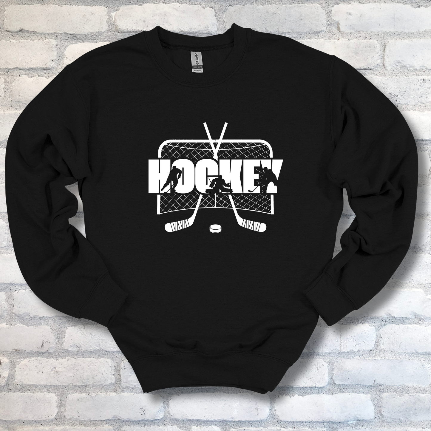 Black sweatshirt with hockey graphic on a brick wall background