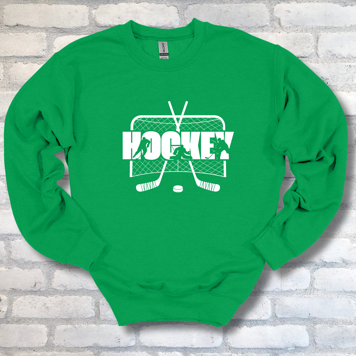 Green sweatshirt with hockey graphic and text on a brick wall background