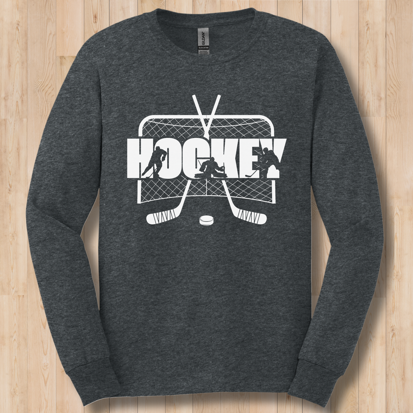 Dark gray long-sleeve shirt with hockey graphic on a wooden surface