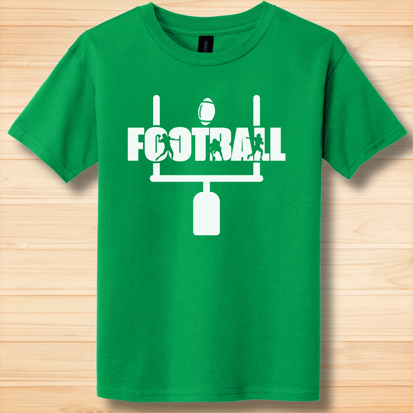 Green t-shirt with white 'FOOTBALL' graphic on a wooden surface