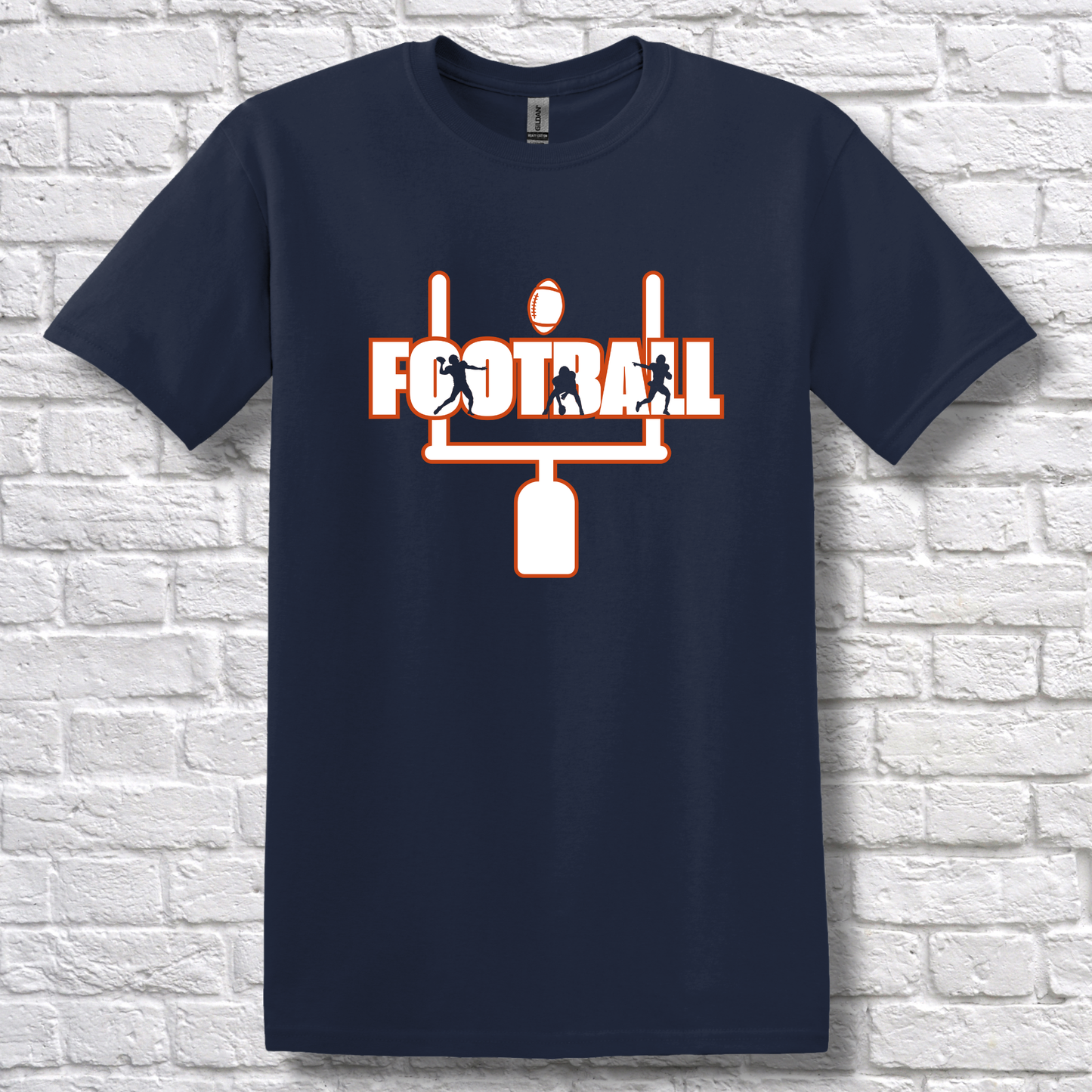 Navy blue t-shirt with football graphic and text on a white brick wall background
