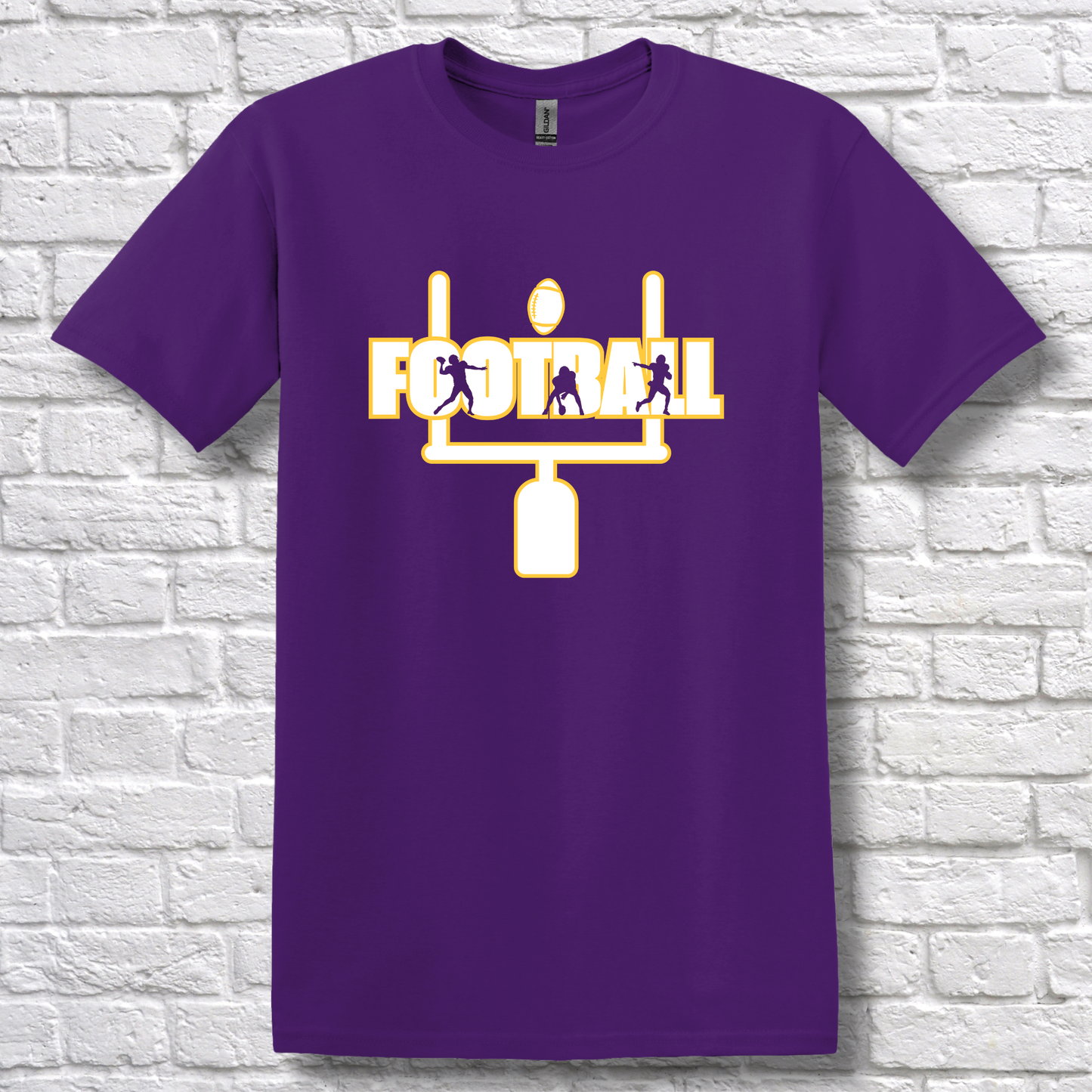 Purple t-shirt with yellow football graphic and text on a white brick wall background