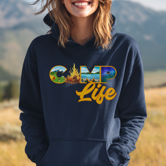 Person wearing a navy hoodie with 'CAMP Life' text and graphics in an outdoor setting