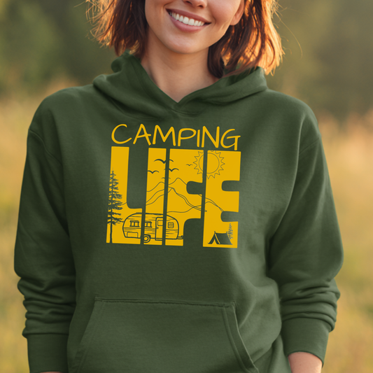 Person wearing a green hoodie with 'Camping Life' design in yellow outdoors.