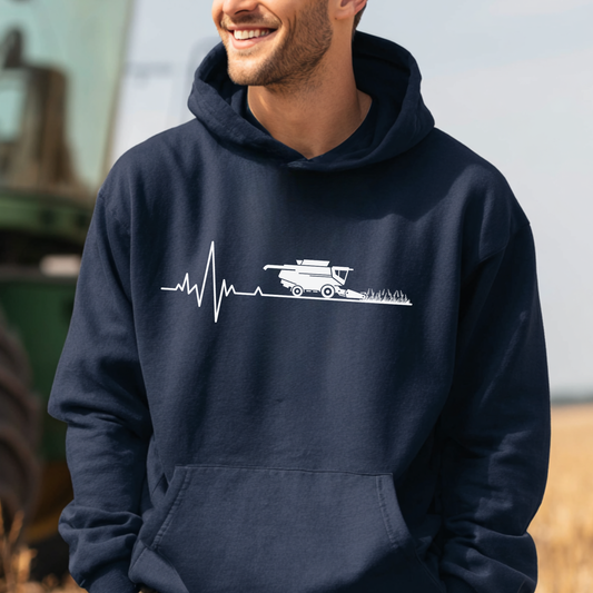 Person wearing a navy hoodie with a white graphic design outdoors