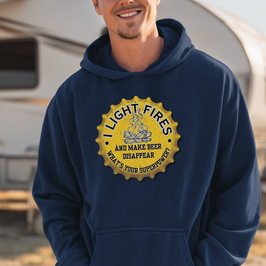 Person wearing a navy hoodie with a yellow graphic and text, standing in front of an RV.