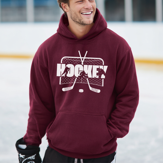 Man wearing a maroon hoodie with a hockey graphic on an ice rink
