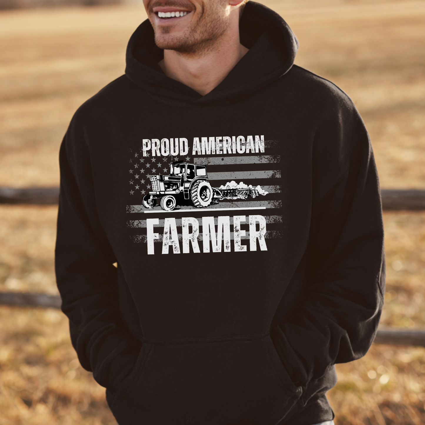 Person wearing a black hoodie with 'Proud American Farmer' text and tractor graphic.
