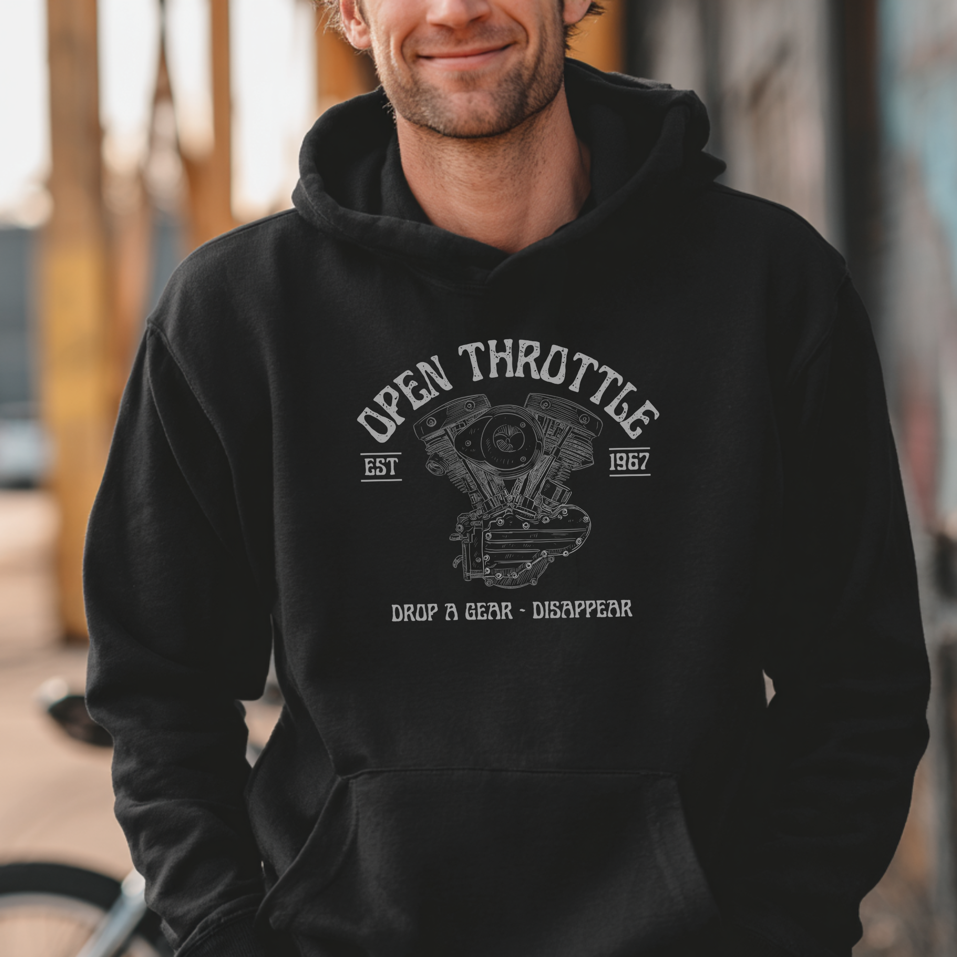 Person wearing a black hoodie with 'Open Throttle' graphic design.